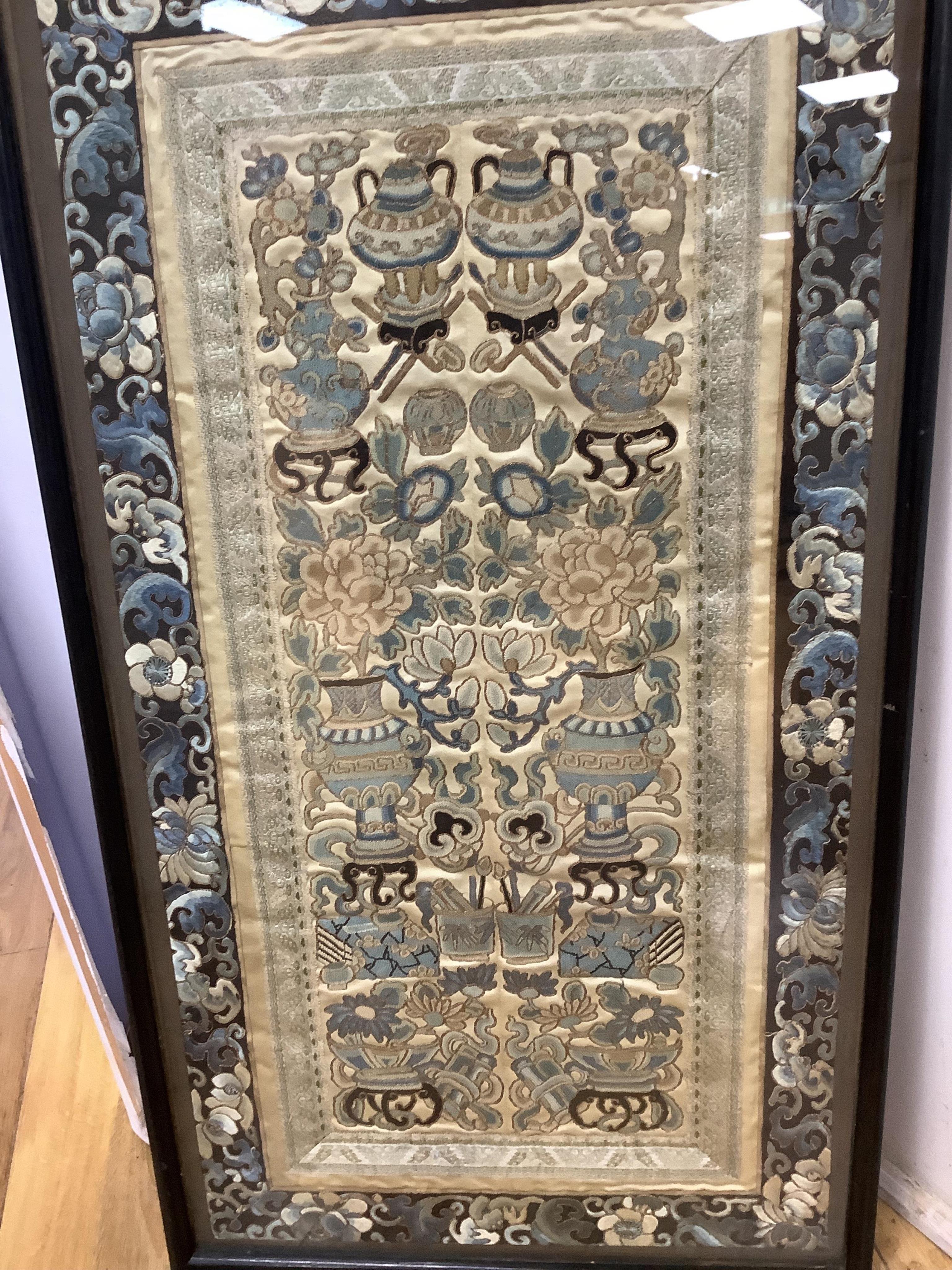Two pairs of 19th century Chinese, Peking knot, silk embroidered sleeve bands. Worked on cream silk. Both embroidered mostly in blues and gilt thread, in flower, bird and auspicious motifs, both bordered with black silk